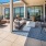 Outdoor lounge at our South Waterfront apartments, featuring outdoor couches and a view of the city.